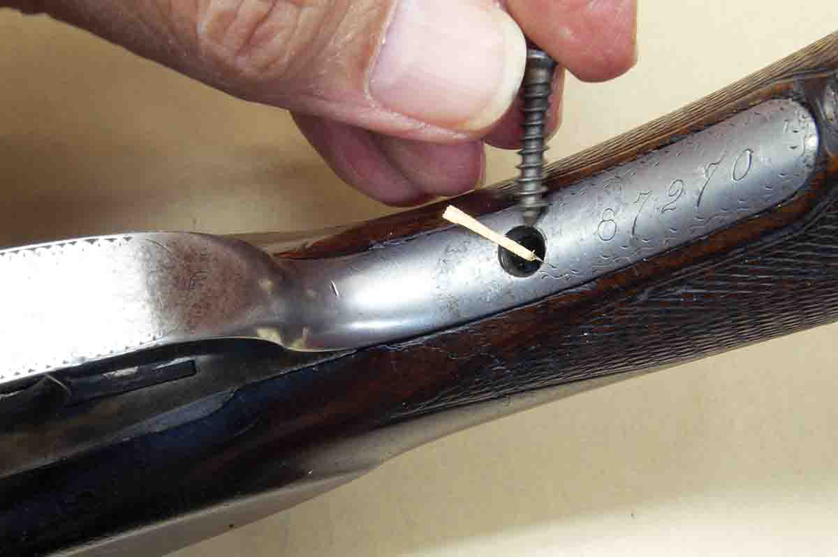 It is sometimes possible to tighten the fit of a loose wood screw by placing a short piece of flat toothpick in the hole.